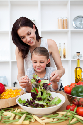 Mother and Child preparing a salad